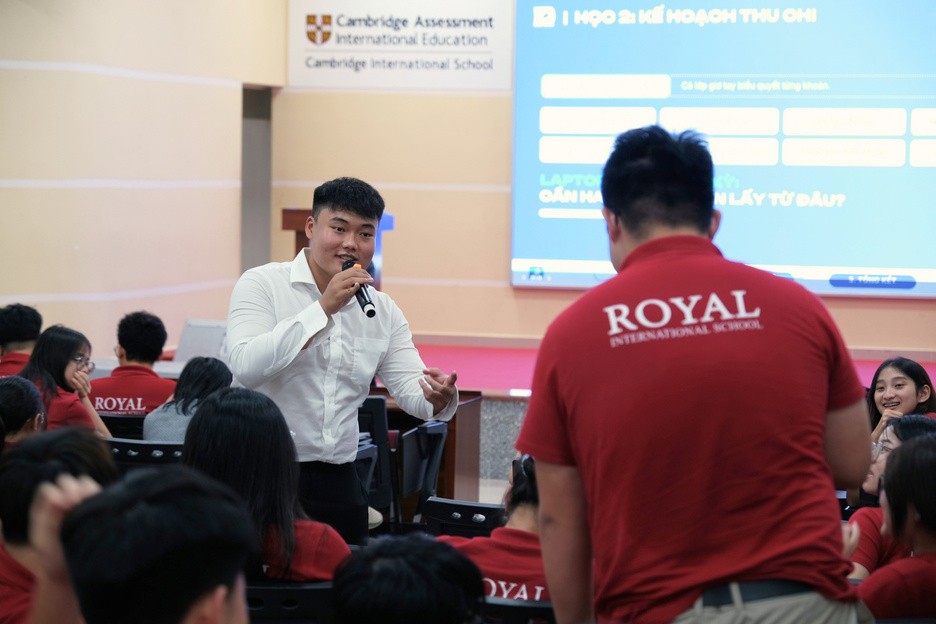 A speaker leading a money workshop